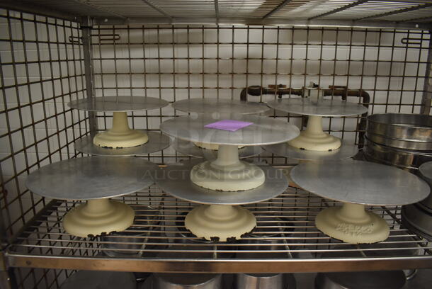Chrome Finish 4 Tier Wire Shelving Unit w/ Liquor Cage on Commercial Casters. Comes w/ Contents Including 10 Metal Cake Stands and Various Metal Round Baking Pans. BUYER MUST DISMANTLE. PCI CANNOT DISMANTLE FOR SHIPPING. PLEASE CONSIDER FREIGHT CHARGES. 48x25x70. (Pastry Kitchen) - Image 3 of 7