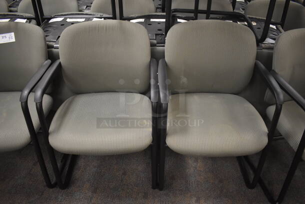 20 Gray Chairs w/ Arm Rests. Stock Picture - Cosmetic Condition May Vary. BUYER MUST REMOVE. 23x20x33. 20 Times Your Bid! (Classroom 5-8)
