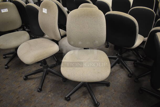 20 Gray Office Chairs on Casters. Stock Picture - Cosmetic Condition May Vary. BUYER MUST REMOVE. 21x22x38. 20 Times Your Bid! (Classroom 5-8)