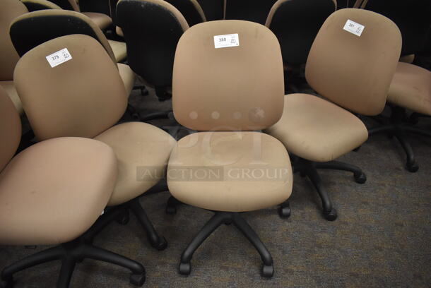 22 Tan/Pink Office Chairs on Casters. Stock Picture - Cosmetic Condition May Vary. BUYER MUST REMOVE. 21x20x38. 22 Times Your Bid! (Classroom 5-8)