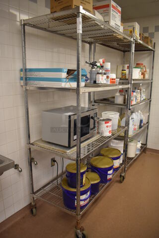 Metal 4 Tier Wire Shelving Unit on Commercial Casters. Does Not Include Contents. BUYER MUST DISMANTLE. PCI CANNOT DISMANTLE FOR SHIPPING. PLEASE CONSIDER FREIGHT CHARGES. 48x24x78. (Pastry Kitchen)