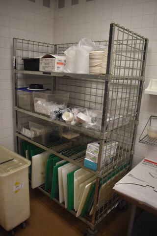 Metal 4 Tier Wire Shelving Unit on Commercial Casters w/ Contents Including Cutting Boards. BUYER MUST DISMANTLE. PCI CANNOT DISMANTLE FOR SHIPPING. PLEASE CONSIDER FREIGHT CHARGES. 48x24x70. (Education Kitchen 2) 