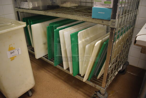Metal 4 Tier Wire Shelving Unit on Commercial Casters w/ Contents Including Cutting Boards. BUYER MUST DISMANTLE. PCI CANNOT DISMANTLE FOR SHIPPING. PLEASE CONSIDER FREIGHT CHARGES. 48x24x70. (Education Kitchen 2)  - Image 4 of 5