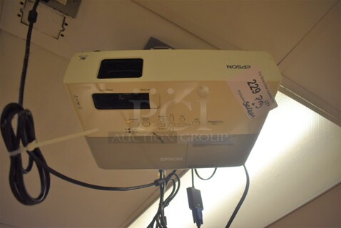 Epson Ceiling Mounted Projector and Pull Down Projection Screen. BUYER MUST REMOVE. 11x8x4, 94". (Education Kitchen 2)
