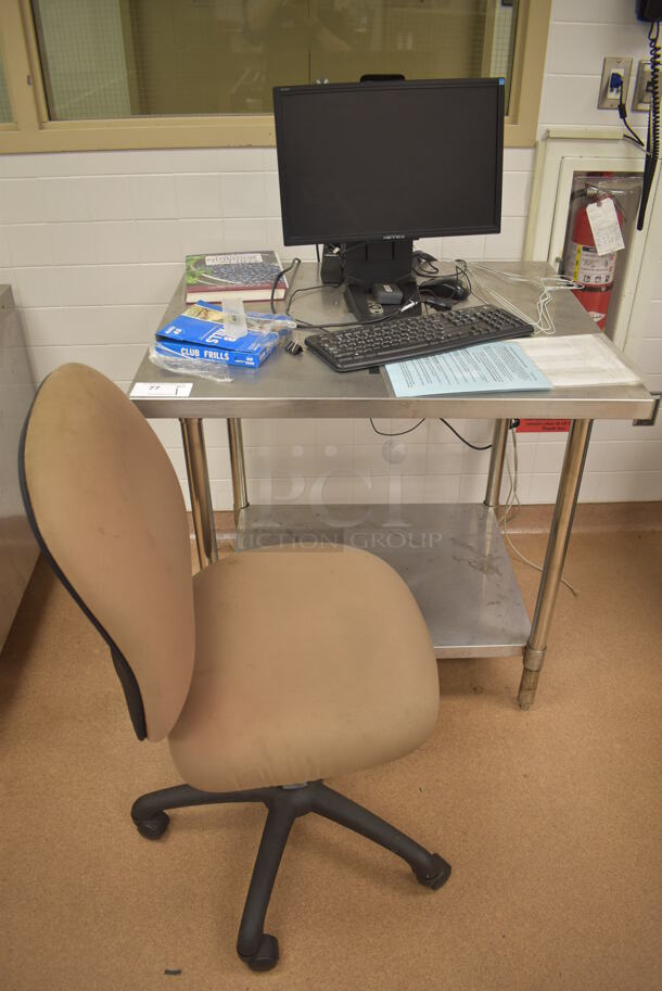 Stainless Steel Table w/ Metal Under Shelf. Comes w/ Hanns-G Computer Monitor, Computer Keyboard and Tan Computer Chair. 36x30x36. (Education Kitchen)