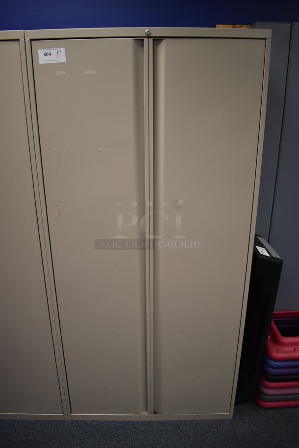 Tan Metal 2 Door Cabinet w/ Contents. 36x20x75. (Classroom 10)