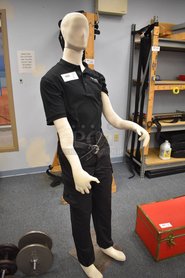 Mannequin in YTI Attire. 23x18x73. (Classroom 10)