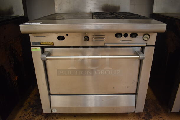 Garland M42-6R Stainless Steel Commercial Natural Gas Powered 2 Burner Range w/ Flat Top, Oven, Over Shelf and Back Splash. BUYER MUST REMOVE. 34x38x58. Tested and Working! (Education Kitchen) - Image 5 of 7
