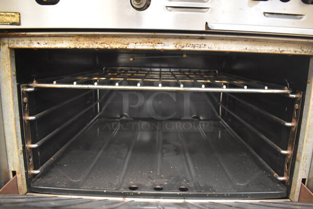 Garland M42-6R Stainless Steel Commercial Natural Gas Powered 2 Burner Range w/ Flat Top, Oven, Over Shelf and Back Splash. BUYER MUST REMOVE. 34x38x58. Tested and Working! (Education Kitchen) - Image 6 of 7