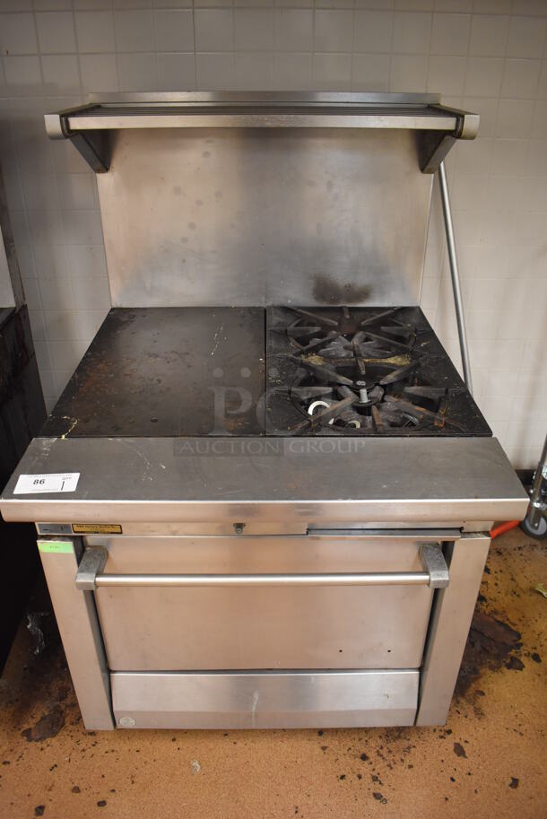 Garland M42-6R Stainless Steel Commercial Natural Gas Powered 2 Burner Range w/ Flat Top, Oven, Over Shelf and Back Splash. BUYER MUST REMOVE. 34x38x58. Tested and Working! (Education Kitchen)