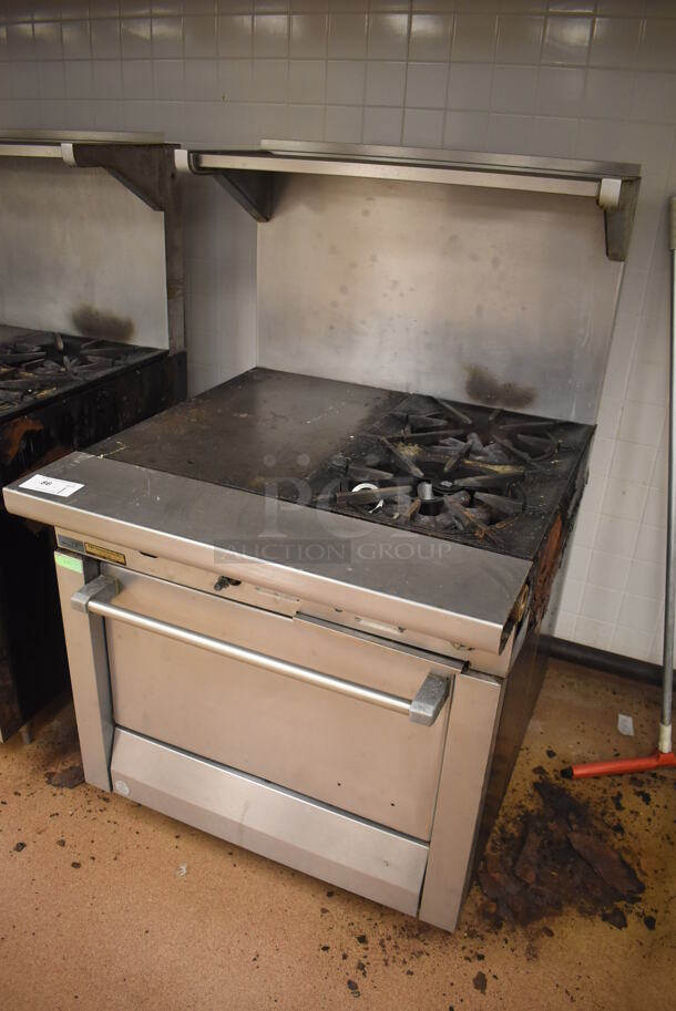 Garland M42-6R Stainless Steel Commercial Natural Gas Powered 2 Burner Range w/ Flat Top, Oven, Over Shelf and Back Splash. BUYER MUST REMOVE. 34x38x58. Tested and Working! (Education Kitchen) - Image 2 of 8