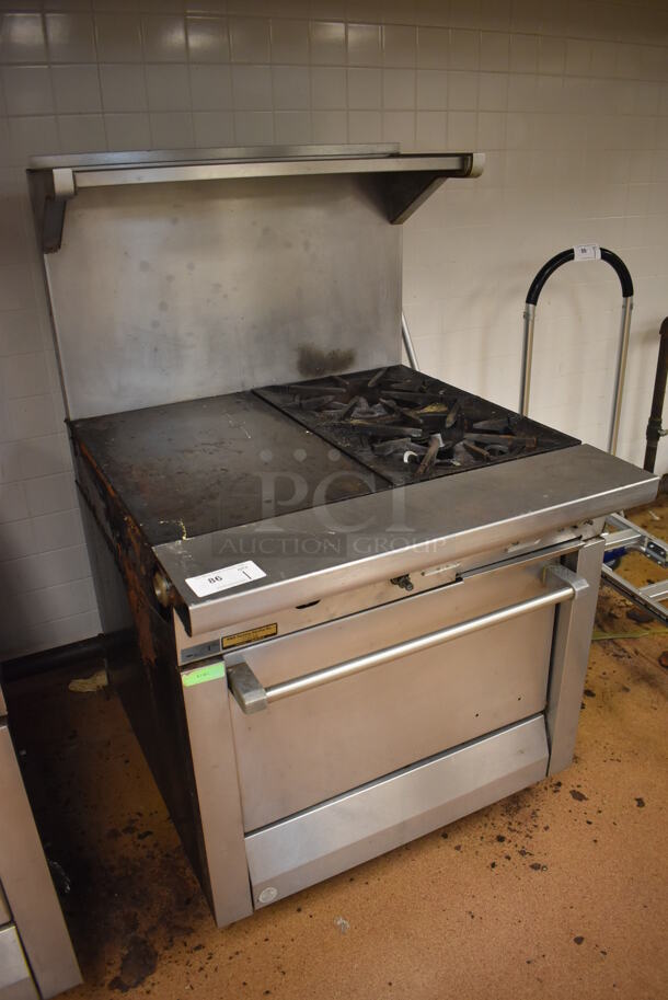 Garland M42-6R Stainless Steel Commercial Natural Gas Powered 2 Burner Range w/ Flat Top, Oven, Over Shelf and Back Splash. BUYER MUST REMOVE. 34x38x58. Tested and Working! (Education Kitchen) - Image 3 of 8