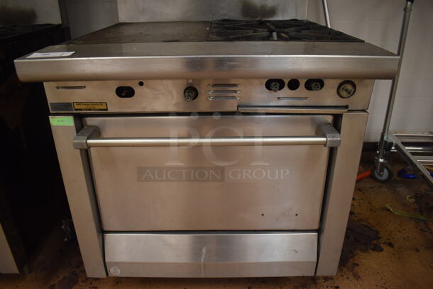 Garland M42-6R Stainless Steel Commercial Natural Gas Powered 2 Burner Range w/ Flat Top, Oven, Over Shelf and Back Splash. BUYER MUST REMOVE. 34x38x58. Tested and Working! (Education Kitchen) - Image 4 of 8