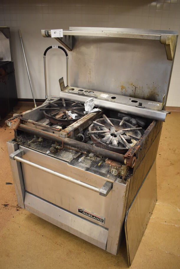 Garland M42-6R Stainless Steel Commercial Natural Gas Powered 2 Burner Range w/ Flat Top, Oven, Over Shelf and Back Splash. BUYER MUST REMOVE. 34x38x58. For Parts. (Education Kitchen) - Image 2 of 8