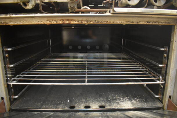 Garland M42-6R Stainless Steel Commercial Natural Gas Powered 2 Burner Range w/ Flat Top, Oven, Over Shelf and Back Splash. BUYER MUST REMOVE. 34x38x58. For Parts. (Education Kitchen) - Image 6 of 8