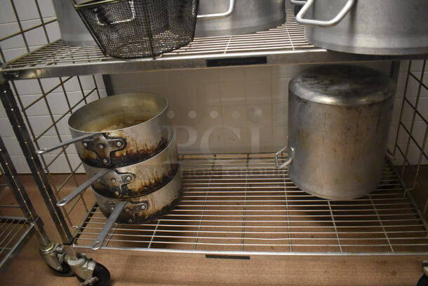 Metal 4 Tier Wire Shelving Unit on Commercial Casters w/ Contents Including Metal Stock Pots and Sauce Pans. BUYER MUST DISMANTLE. PCI CANNOT DISMANTLE FOR SHIPPING. PLEASE CONSIDER FREIGHT CHARGES. 48x24x78. (Dishroom) - Image 4 of 4