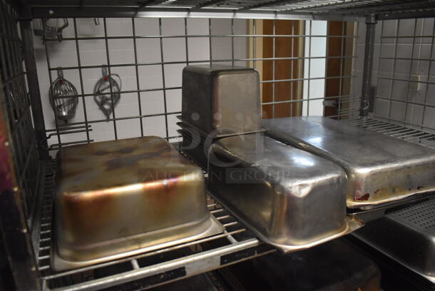 Metal 4 Tier Wire Shelving Unit on Commercial Casters w/ Contents Including Stainless Steel Drop In Bins. BUYER MUST DISMANTLE. PCI CANNOT DISMANTLE FOR SHIPPING. PLEASE CONSIDER FREIGHT CHARGES. 48x24x70. (Dishroom) - Image 3 of 5