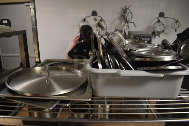 Metal 4 Tier Wire Shelving Unit on Commercial Casters w/ Contents Including Metal Lids, Baking Pans and Cylindrical Drop In Bins. BUYER MUST DISMANTLE. PCI CANNOT DISMANTLE FOR SHIPPING. PLEASE CONSIDER FREIGHT CHARGES. 48x24x78. (Dishroom) - Image 2 of 7