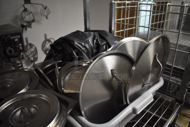 Metal 4 Tier Wire Shelving Unit on Commercial Casters w/ Contents Including Metal Lids, Baking Pans and Cylindrical Drop In Bins. BUYER MUST DISMANTLE. PCI CANNOT DISMANTLE FOR SHIPPING. PLEASE CONSIDER FREIGHT CHARGES. 48x24x78. (Dishroom) - Image 3 of 7