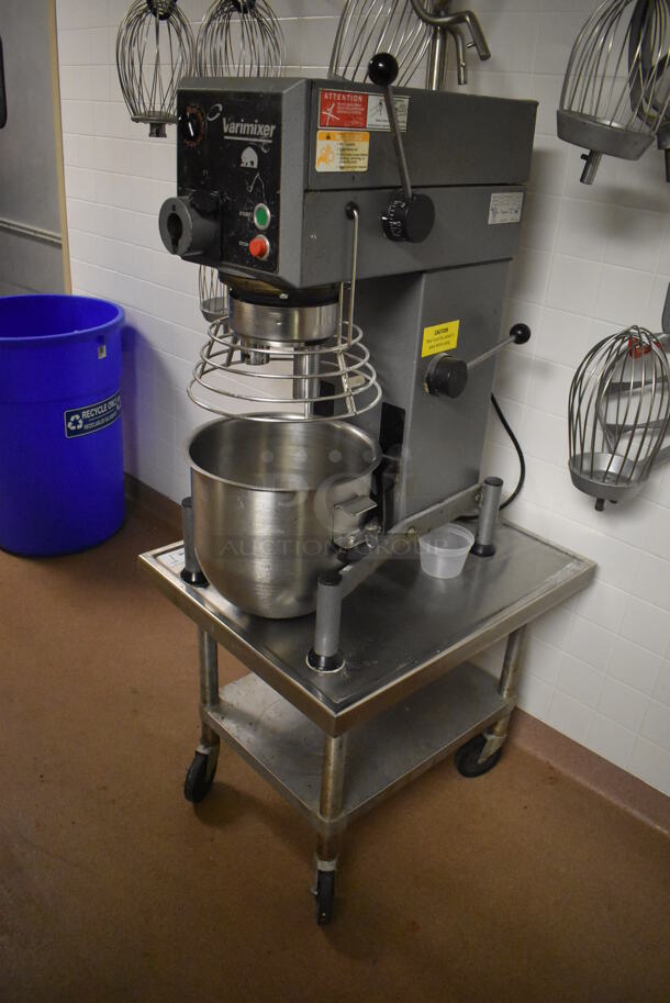 Varimixer W20 Metal Commercial Countertop 20 Quart Planetary Dough Mixer w/ Stainless Steel Mixing Bowl, Bowl Guard and Numerous Attachments on Stainless Steel Mixer Equipment Stand w/ Commercial Casters. 115 Volts, 1 Phase. 17x26x35, 24x30x24. (Dishroom)