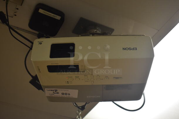 Epson Ceiling Mounted Projector and Pull Down Projection Screen. BUYER MUST REMOVE. 11x8x4, 94