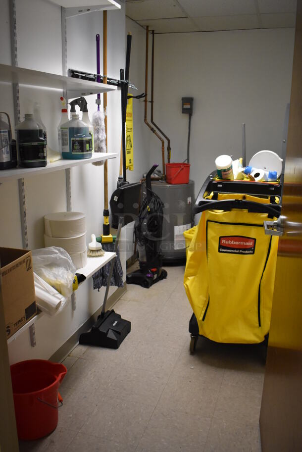 ALL ONE MONEY! Room Lot of Various Items Including Janitorial Cart, and Vacuum Cleaner. Does Not Include Water Heater or Shelving. BUYER MUST REMOVE. (Facilities Closet)