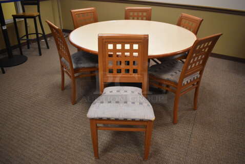 Round Dining Height Table on Black Metal Table Base w/ 6 Wood Pattern Dining Chairs w/ Blue Patterned Seat Cushion. 60x60x29, 19x17x36. (Dining Room)