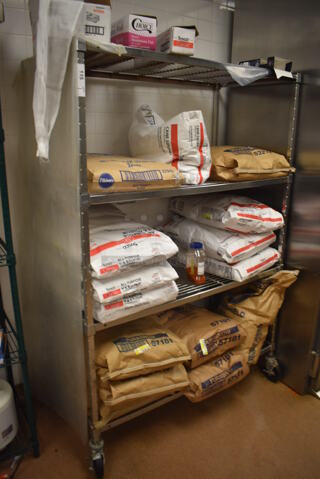 Metal 4 Tier Wire Shelving Unit on Commercial Casters. Does Not Include Contents. BUYER MUST DISMANTLE. PCI CANNOT DISMANTLE FOR SHIPPING. PLEASE CONSIDER FREIGHT CHARGES. 48x24x70. (Restaurant Kitchen)