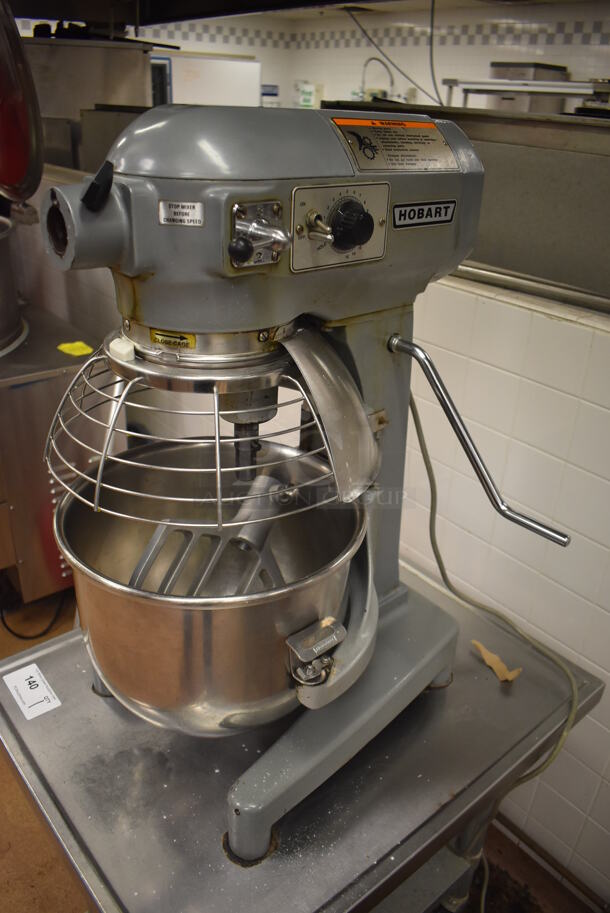 Hobart A200 Metal Commercial Countertop 20 Quart Planetary Dough Mixer w/ 2 Metal Mixing Bowls, Bowl Guard and Paddle Attachment on Stainless Steel Equipment Stand on Commercial Casters. 115 Volts, 1 Phase. 16x23x30, 24x30x29. Tested and Working! Metal Commercial Gas Powered Single Door Smoker on Commercial Casters. BUYER MUST REMOVE. 22x30x56. Tested and Working! (Restaurant Kitchen) - Image 2 of 8