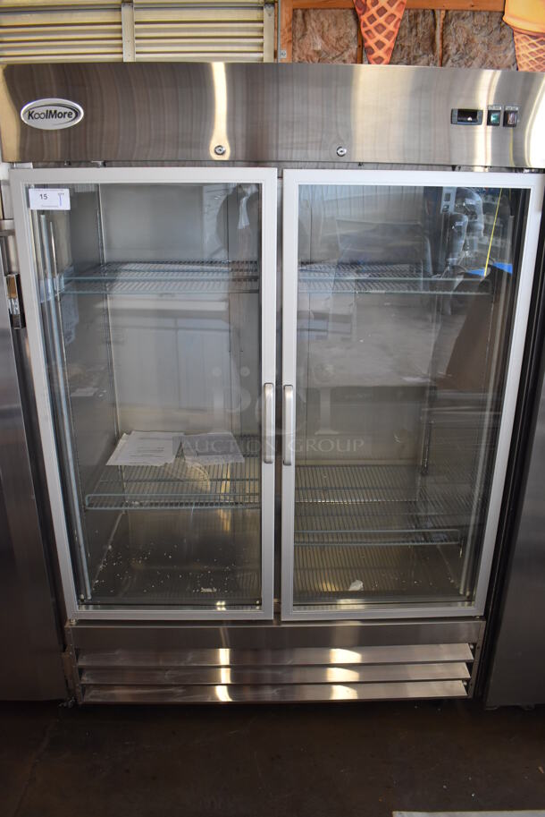SCRATCH AND DENT! KoolMore RIR-2D-GD Stainless Steel Commercial 2 Door Reach In Cooler Merchandiser w/ Poly Coated Racks on Commercial Casters. 115 Volts, 1 Phase. 54x34x82. Tested and Powers On But Does Not Get Cold