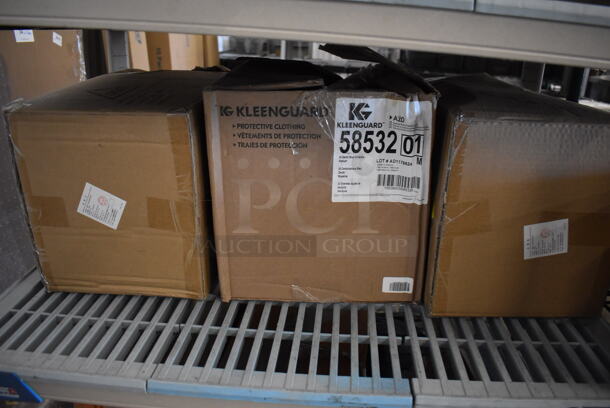 ALL ONE MONEY! Tier Lot of Various Items Including Kleenguard Protective Clothing Box and 2 GGS Collared Poly Elastic Clothes Covering Boxes - Image 6 of 7