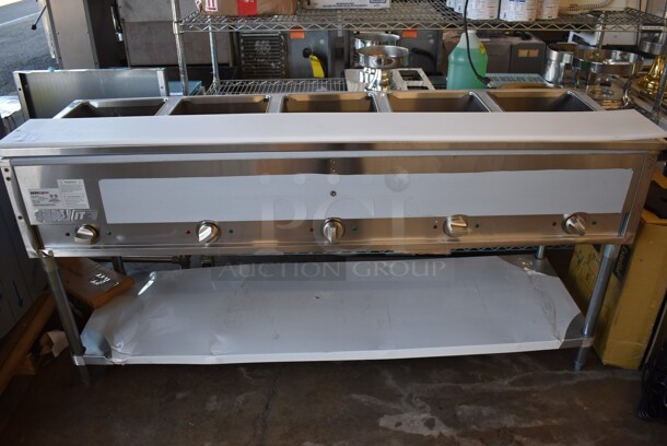 BRAND NEW SCRATCH AND DENT! ServIt 423EST5WO Stainless Steel Commercial Electric Powered 5 Well Steam Table w/ Cutting Board and Under Shelf. 208/240 Volts, 1 Phase. 71x23x36. Tested and Working!