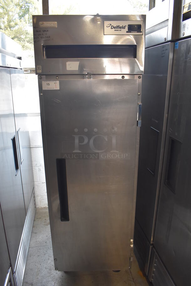 2010 Delfield 6125XL-S-STAR1 ENERGY STAR Stainless Steel Commercial Single Door Reach In Freezer w/ Metal Racks on Commercial Casters. 115 Volts, 1 Phase. 25.5x33.5x79.5. Tested and Working!