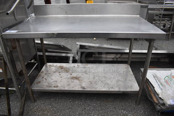 Stainless Steel Table w/ Back Splash and Under Shelf. 54x30x40.5