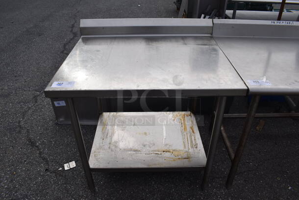 Stainless Steel Table w/ Back Splash and Under Shelf. 36x30x38