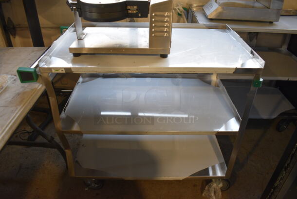 BRAND NEW SCRATCH AND DENT! Regency Stainless Steel Commercial Three Tier 18 Gauge 430 Stainless Steel Utility Cart on Commercial Casters. 22x38.5x34
