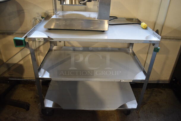 BRAND NEW SCRATCH AND DENT! Regency Stainless Steel Commercial Three Tier 18 Gauge 430 Stainless Steel Utility Cart on Commercial Casters. 22x38.5x34
 - Image 1 of 5