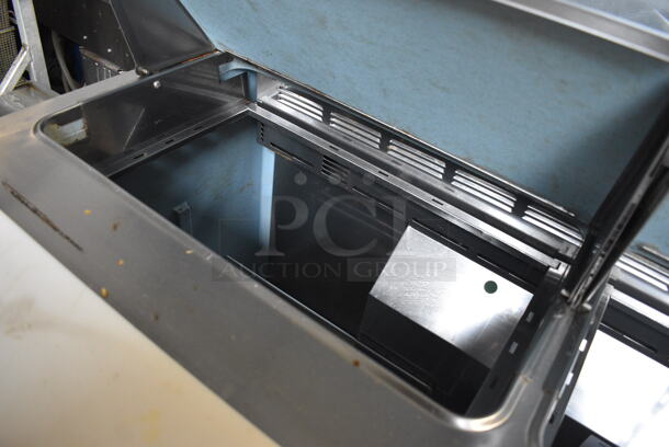 Delfield 4448N-12-A831 Stainless Steel Commercial Sandwich Salad Prep Table Bain Marie Mega Top on Commercial Casters. 115 Volts, 1 Phase. 48x32.5x40.5. Tested and Powers On But Temps at 44 Degrees - Image 5 of 8