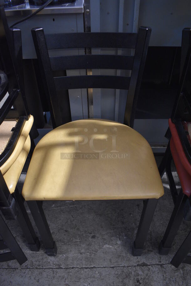 2 Black Metal Dining Height Chairs w/ Yellow Seat Cushions. Stock Picture - Cosmetic Condition May Vary. 16x16x32. 2 Times Your Bid! - Image 1 of 5