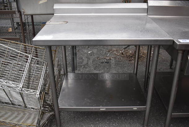 Stainless Steel Table w/ Back Splash and Under Shelf. 38x30x38.5