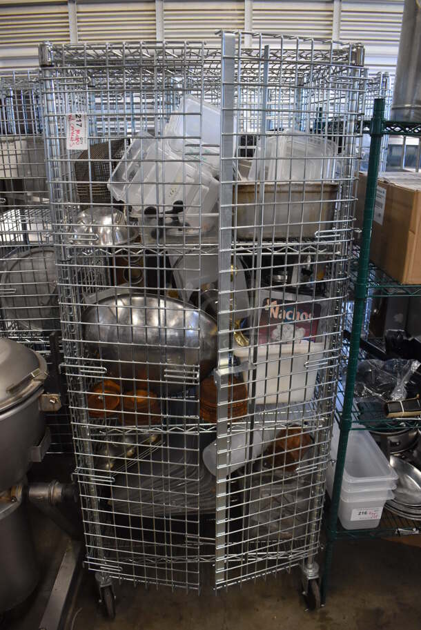 Chrome Finish 4 Tier Wire Shelving Unit w/ Liquor Cage and Contents on Commercial Casters. BUYER MUST DISMANTLE. PCI CANNOT DISMANTLE FOR SHIPPING. PLEASE CONSIDER FREIGHT CHARGES. 30x20x70 - Image 1 of 7