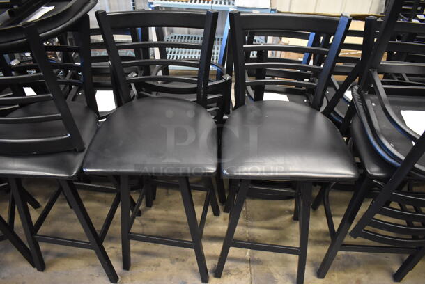 4 Black Metal Bar Height Swivel Chairs w/ Black Seat Cushion and Horizontal Back Rest Bars. Stock Picture - Cosmetic Condition May Vary. 17x18x43.5. 4 Times Your Bid! - Image 1 of 6