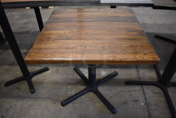 Wooden Bar Height Tables on Black Metal Table Base. Stock Picture - Cosmetic Condition May Vary. 36x36x30 - Image 1 of 4