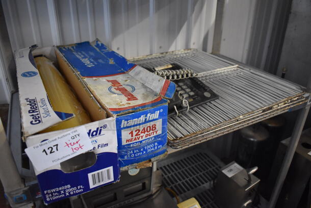ALL ONE MONEY! Tier Lot of Various Items Including Racks, Phone and Plastic Film - Image 1 of 4