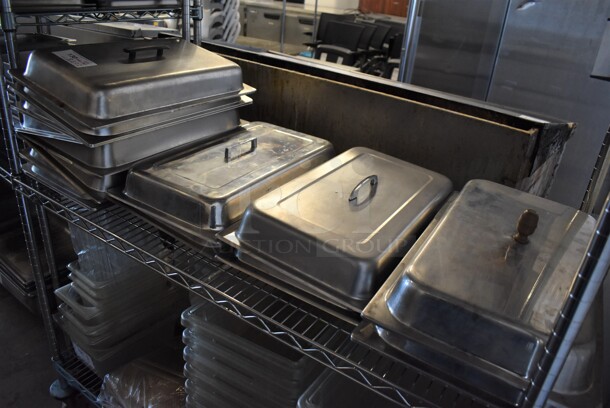 ALL ONE MONEY! Tier Lot of 14 Various Stainless Steel Lids. 13x21x4 - Image 1 of 3