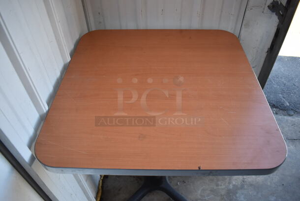 2 Wood Pattern Dining Height Table on Black Metal Table Base. Stock Picture - Cosmetic Condition May Vary. 24x24x29.5. 2 Times Your Bid! - Image 3 of 4