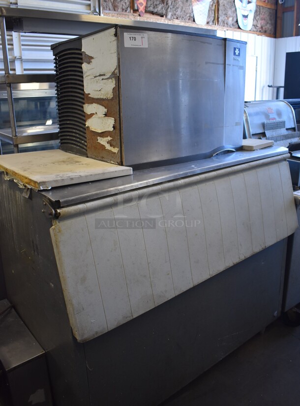 Manitowoc SY0604A Stainless Steel Commercial Ice Machine Head on Commercial Bin. 208-230 Volts, 1 Phase. 52x32x68