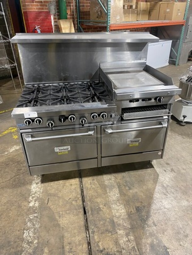 BEAUTIFUL! Garland Commercial Natural Gas Powered 6 Burner Stove With Right Side Flat Griddle! Griddle Has Side Splashes! With Raised Back Splash And Salamander Shelf! With 2 Oven Underneath! ONE OVEN WITH CONVECTION! Metal Oven Racks! All Stainless Steel! On Legs!