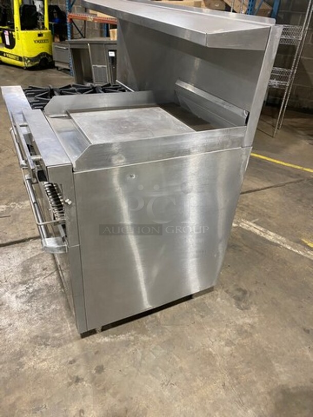 BEAUTIFUL! Garland Commercial Natural Gas Powered 6 Burner Stove With Right Side Flat Griddle! Griddle Has Side Splashes! With Raised Back Splash And Salamander Shelf! With 2 Oven Underneath! ONE OVEN WITH CONVECTION! Metal Oven Racks! All Stainless Steel! On Legs! - Image 2 of 12