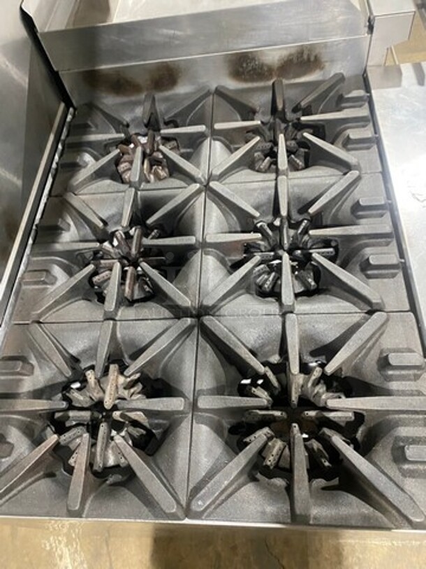 BEAUTIFUL! Garland Commercial Natural Gas Powered 6 Burner Stove With Right Side Flat Griddle! Griddle Has Side Splashes! With Raised Back Splash And Salamander Shelf! With 2 Oven Underneath! ONE OVEN WITH CONVECTION! Metal Oven Racks! All Stainless Steel! On Legs! - Image 5 of 12